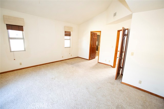Master Suite: Vaulted ceiling, entry door to Full Bathroom