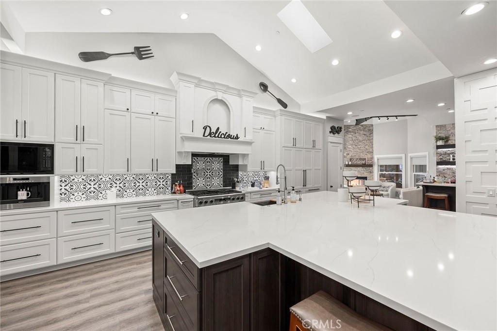 “CUSTOM KITCHEN” Wolf Built-In Coffee Station & Microwave
Cove Dishwasher, Six-Burner Dacor Stove & Oven