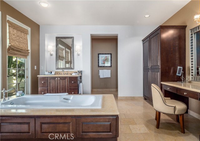 The oversize soaking tub in the master bathroom looks out into a private courtyard