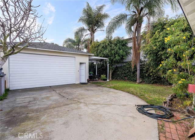 Over sized two car detached garage with the perfect sized patio for al fresco dining
