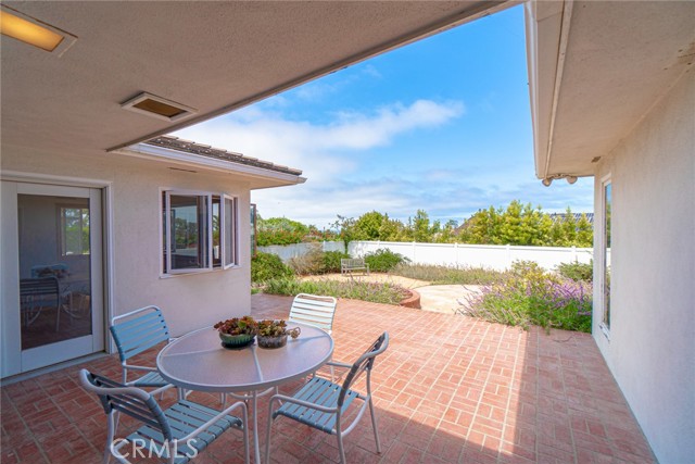 Patio that is accessible by living and dining room with ocean views