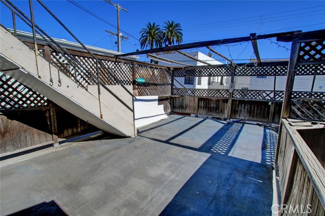 Large rooftop deck at upper back of property.