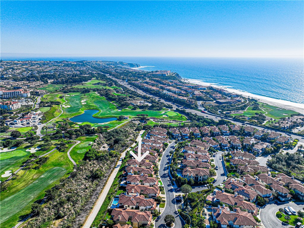 This beautiful serene home is in a small exclusive Pointe Monarch gated community next to the five-star Waldorf Astoria Resort and Club overlooking the Monarch Beach Golf Links golf course. Point Monarch Beach Resort Estates only has 45 homes in the community and this is the first time this home has been available in  20 years. This immaculate home offers the ultimate in luxury beach living with added security and walking distance to the beach, fine dining restaurants, the Ritz Carlton Laguna Niguel and The Montage Resort Laguna Beach. The home has four bedrooms – including two masters all with ensuite bathrooms. One of the bedrooms is downstairs and has a kitchenette with it’s own patio ideal for in-law unit. The master bedroom has a fireplace, expansive bathroom and walk in closet. The home was recently remodeled with beautiful imported Italian wood flooring the family room and dining area. The kitchen is adorned with high-end white cabinetry, Sub-Zero refrigerator, wine refrigerator, Dacor appliances including double oven and six burner gas range and warming drawer.  The home sits with picturesque expansive views of the beautiful Monarch Beach Golf Links golf course and on the Salt Creek beach trail with only a 10 minute walk from Southern California’s most beautiful beach. Pointe Monarch is a five minute drive into downtown Dana Point with it’s new restaurant, shopping district and the harbor. There is beach walks, surfing, hiking, scuba diving, snorkeling, jet skies and sailing near by just to name a few of the activities near by.