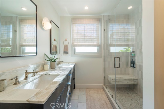 Bathroom off the hallway is functional and elegant