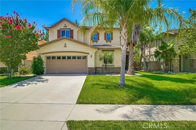 12445 Harwick Drive Rancho Cucamonga, California Looking for an abundance of space with 2 bedrooms downstairs, 4 bedrooms upstairs plus a loft? You will LOVE this contemporary Rancho Cucamonga home located in a quality school district near Victoria Gardens! This flexible, spacious floor plan is ideal for your unique lifestyle. Double entry doors open to an expansive formal living room with decorative wall moulding under a soaring 2-story ceiling! Have fun dinner parties in the formal dining room. Fabulous sleek kitchen features quartz counter tops, an island breakfast bar, stainless steel appliances, double ovens, walk-in pantry & gleaming glass mosaic back splash. The kitchen opens to the family room with a beautiful fireplace & built-in media center. A sliding glass door opens to the covered patio for outdoor dining. Extensive use of laminate wood flooring; Gorgeous chandeliers in the family room & master suite! Two main level bedrooms are perfect for in-laws & guests. The large loft can easily be a game room! Double doors open to the spacious master suite with a fantastic ensuite bathroom designed to help you unwind at the end of the day. It offers dual walk-in closets, a soaking tub, walk-in shower, separate sinks & a glam bar. All bedrooms are generous in size, and the main level bathroom with a shower offers gorgeous upgrades. Have fun BBQs in the private backyard with a solid aluminum patio cover & concrete floor. Take a closer look at this exceptional home today!
