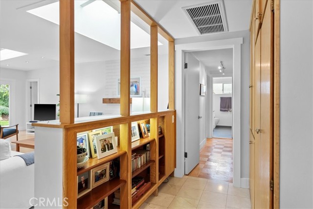 Hallway with storage off the entry to the 3 bedrooms.