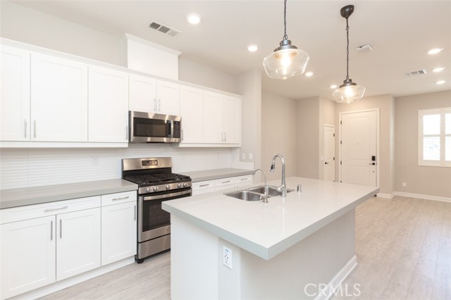 View of kitchen from garage door.