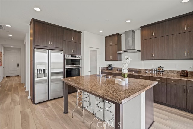 Kitchen with oversized island ans stainless steel appliances