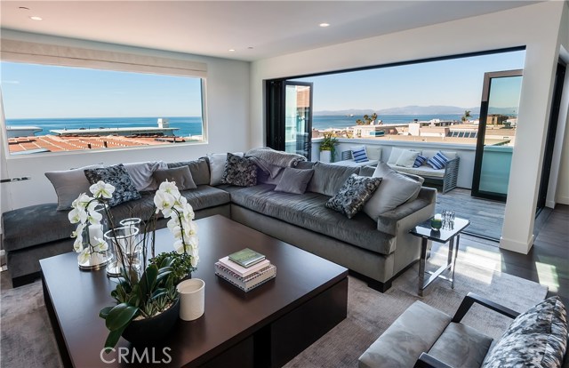 2215 Bayview Drive Manhattan Beach, California 2018 remodeled Modern Santa Barbara style townhome offers sweeping ocean views to Malibu. This 4 bedroom plus office/den home has the highest quality materials throughout. The living room features a folding door system that creates seamless flow the deck and the living and dining rooms. The living space brings in the panoramic ocean views and the sound of the waves throughout the main living area. The kitchen features high-end cabinets, 8 burner Viking Range, SubZero wine-fridge and refrigerator. The wide plank hardwood floors create a casual elegance and complements the beautifully remodeled baths. One of the bedrooms has been set up as an amazing workout room. Bayview is an awesome street for families as it’s low traffic and flat making it idea for kids to play. In addition to being a beautifully upgraded home it also offers a quiet neighborhood, easy access to the beach and a short walk to restaurants and shops. This home is in the award-winning Grandview Elementary, MBMS and Mira Costa High School.