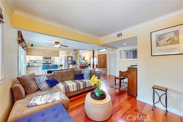 Family room with beautiful wood flooring was a 4th bedroom in the past