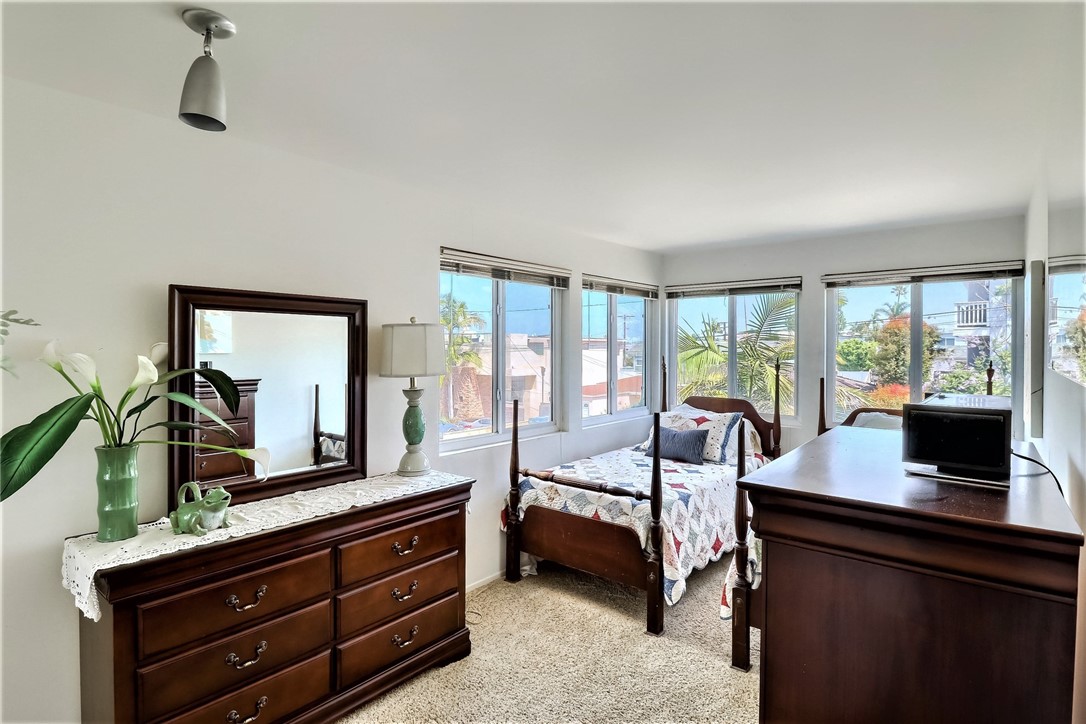 The Lower Level Third Bedroom is Surrounded with Windows Opening to Ocean Views.