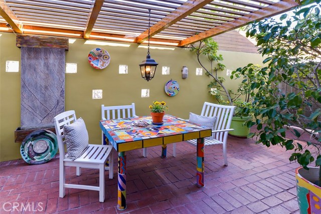 The enclosed, private patio with a relaxing water feature.  Perfect for entertaining or al fresco dining!