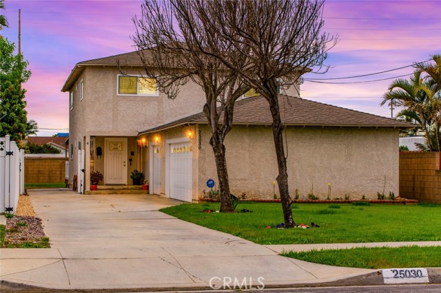25030 Feijoa Avenue Lomita, California Welcome to this "Pride of ownership" custom built home. Since 1983 the home has had many upgrades to aesthetically meet the current trends. The floor plan which enters into the living room, then into the family room and goes directly to a large Trex deck and backyard is great for entertaining. There is a room next to the family room which could be used as a game room or formal dining room. This spacious chef's Kitchen has granite counter tops, travertine floors, mirrored china cabinets, solid Oak cabinets, Stainless steel appliances and an abundance of cabinet space. Family room has a updated granite counter wet bar with mirrored panel shelving and custom brick fireplace with mantle. All extremely large bedrooms are located on the second floor and 2 have built in desks. The spacious master suite comes with a remodeled bath with Granite counters. New carpeting and the remodeled second bath will enhance your living experience. Some of the extra features are the oversize 3 car garage and the large lot that entertains a private RV space next to the home, behind the gate. All fencing (vinyl), deck (Trex) and new block walls have been updated with materials that are maintenance free. For your enjoyment the home comes with solid oak floors, air conditioning and central vacuum system. The home has been upgraded with Milgard windows. The home sits back off the street with a large front yard and long driveway which is great for family and guests.