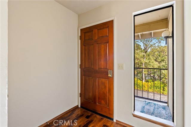 Greet your guests at the door. The long window allows natural light inside.