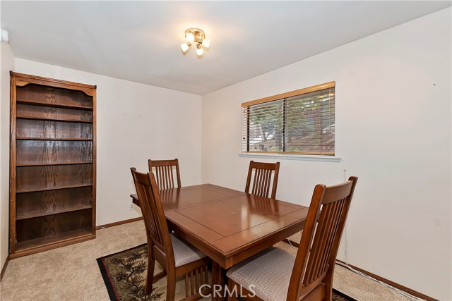 main level bedroom can be used as den or dining area as seen