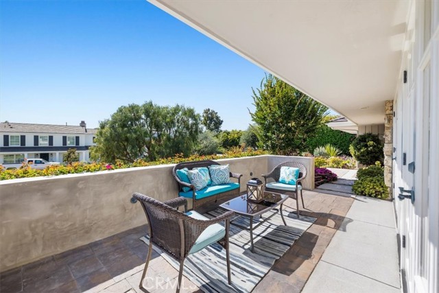 Front Patio flows out from Living Room for enjoying beautiful Ocean and Catalina Views.