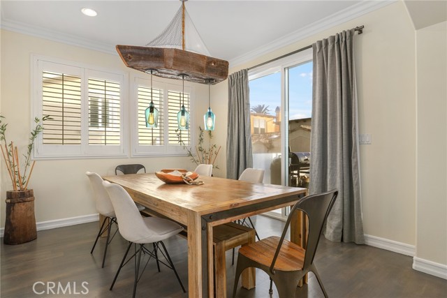 Warm and cozy formal dining room with direct access to the balcony....sunset views from your table as well!