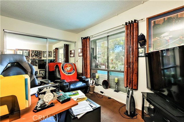 The Second Bedroom has a Large Closet and Windows looking out to The Private Deck