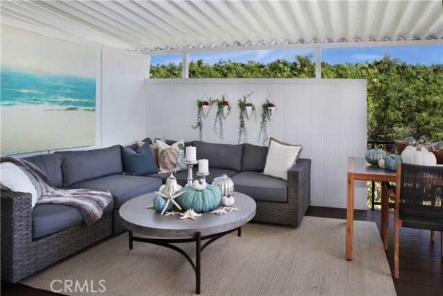 Outdoor covered deck allows for stylish indoor/outdoor living & entertaining.