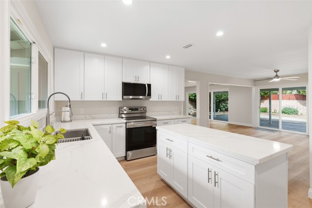 Completely new kitchen featuring quartz countertops and high quality soft-close cabinets.