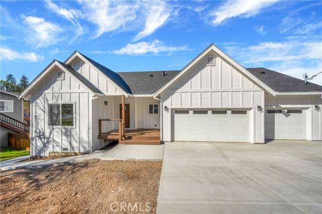 18609 Deer Hill Road Hidden Valley Lake, California BRAND NEW Modern FarmHouse + Lake Views! This 4 bed / 3.5 Bath, 3 Car Garage has 2,439 SQFT, located around the corner from The Little Beach, North Shore Park & the Marina. Prepare to be impressed with high quality finishes throughout this expansive home! A desirable separation floorplan with vinyl plank flooring throughout. 2 comfortable bedrooms & private bath are tucked behind sliding barn doors just off the entry. A private laundry room, including washer/dryer & adjoining 1/2 bath just across the hall. The spacious living room with vaulted ceilings & modern electric fireplace, including a shiplap accent wall, as a focal point. The open concept kitchen/ dining area includes a large center island with farmhouse sink, concrete countertops, stainless steel appliances with 6 burner propane range & hood + Mosaic backsplash. Soft closing cabinetry/drawers & walk-in pantry are sure to please! The covered back deck has gorgeous lake views! The primary bedroom has a large picture window to enjoy the view & ensuite primary bath with dual sinks, concrete countertops, freestanding tub & large walk-in shower with hexagon mosaic tile. The lower level includes a separate family room, 4th bedroom & private bathroom. This Ultra energy efficient home, built using advanced technologies, will include OWNED SOLAR to help keep utility costs low. Imagine living in a brand new home by the end of the year!