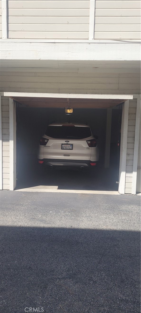 1 car garage, and additional assigned parking