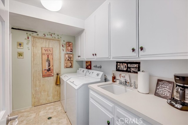 Bottom floor laundry & kitchenette has a refrigerated wine cellar