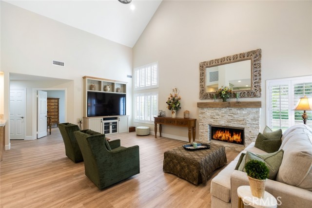 The great room is where you will spend a majority of your time hanging with those you love. Can't you just imagine gathering around this custom stacked stone fireplace with its unique reclaimed wood mantle?