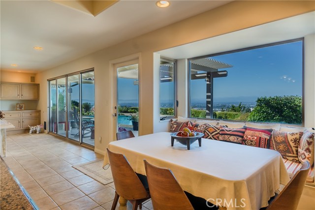 The adjacent breakfast nook includes views from Malibu to the San Bernardino Mountains.