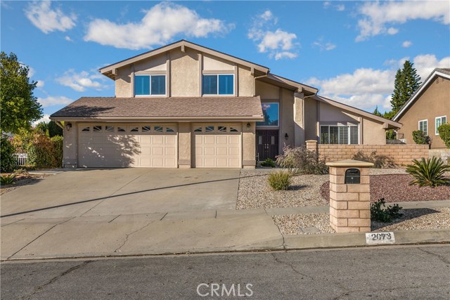 2073 N Albright Avenue Upland, California This Super Sharp, two-story home has been beautifully upgraded inside and out! Immaculate condition and move-in ready! Features newer laminate wood flooring, upgraded neutral carpet, plantation shutters, ceilings fans, freshly painted inside and out. Upon entering thru the double doors, you will appreciate the open design, vaulted ceilings and expansive natural light. Elegant formal living room and spacious formal dining room. Upgraded, bright kitchen includes plenty of cabinet space, Corian counter tops, stainless steel appliances with a large breakfast nook area. Adjoining family room boasts a warm brick fireplace w/a mantle and a wet bar. One of the bedrooms and bathrooms are on the main level. All bathrooms have been nicely remodeled. Impressive master suite includes a large walk-in closet, dual vanity sink. Newer roof, newer HVAC system, whole-house fan, 3 car garage. Nicely landscaped with drought tolerant, water-saving front yard. Resort-like backyard features a sparkling pool & spa, large patio with Alumawood patio cover, plenty of room for entertaining, fruit trees, and fabulous mountain views! Close to McCarthy Park and award-winning schools. This home is truly Turnkey!! Check out the virtual tour!