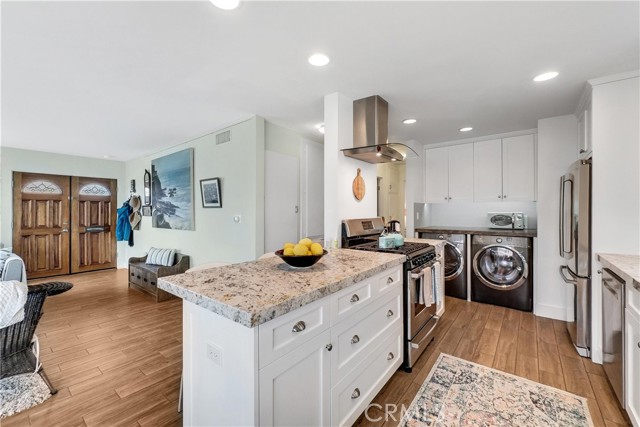 Remodeled open concept kitchen includes all appliances.