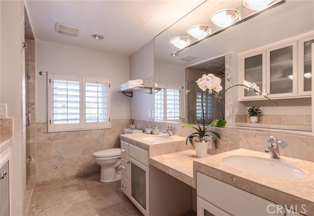 Primary bathroom with dual sinks and make-up counter