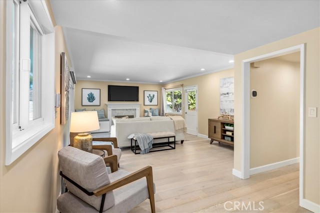 Living room with hardwood floors and recessed lights