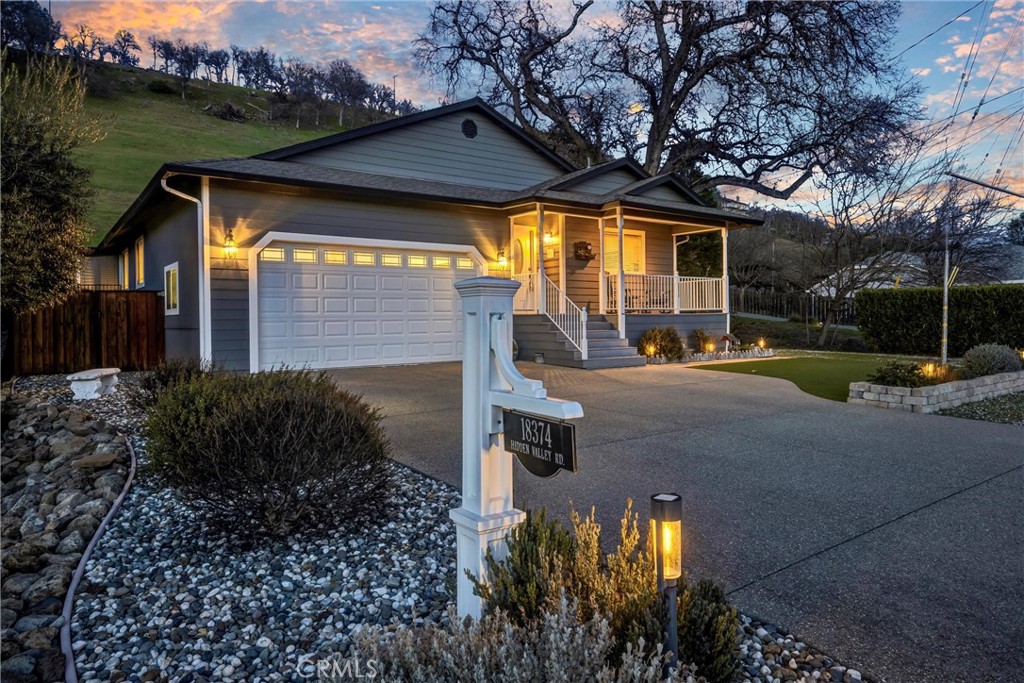 STAYCATION! This single level 3 bed / 2 bath home has 1,627 SF & is situated across the street from Hidden Valley Lakes 18 hole Championship Golf Course. BACKYARD PARADISE! Take a dip in your private INGROUND POOL, relax & entertain at the covered patio with OUTDOOR KITCHEN plumbed with propane, water, & power for convenience! Solid Redwood fencing. Impeccable landscaping front & back- terraced with several entertaining areas, drought tolerant plants & artificial turf enhances outdoor enjoyment. The formal entry leads to an open floorplan viewing the living, dining, & kitchen areas with bamboo flooring and beautiful tray ceilings with recessed lighting. The Kitchen offers granite countertops, center island with butcher block, stainless steel appliances including refrigerator + wine cooler, soft closing cabinetry & a full pantry. Easy backyard access via sliding glass doors at the living room & primary bedroom. Bedrooms include carpet, ceiling fans & are quite spacious. Primary with large walk-in closet & ensuite bath including tiled flooring & upgraded vanity. Indoor laundry with "like new" washer/dryer included! Plenty of room for storage in the large 2 car garage with workbench area or added storage shed. RV/Boat storage via gravel parking pad on the side of the home! Newer exterior paint, water softener system & new smart water monitor to help with insurance requirements! 2 golf carts included to sweeten the deal! The good life awaits at this incredible Hidden Valley Lake OASIS - what more could you ask for!?