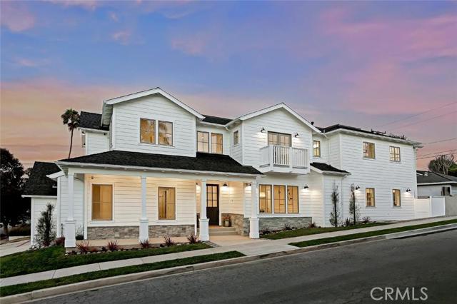 Farmhouse style includes front porch, gooseneck exterior lights