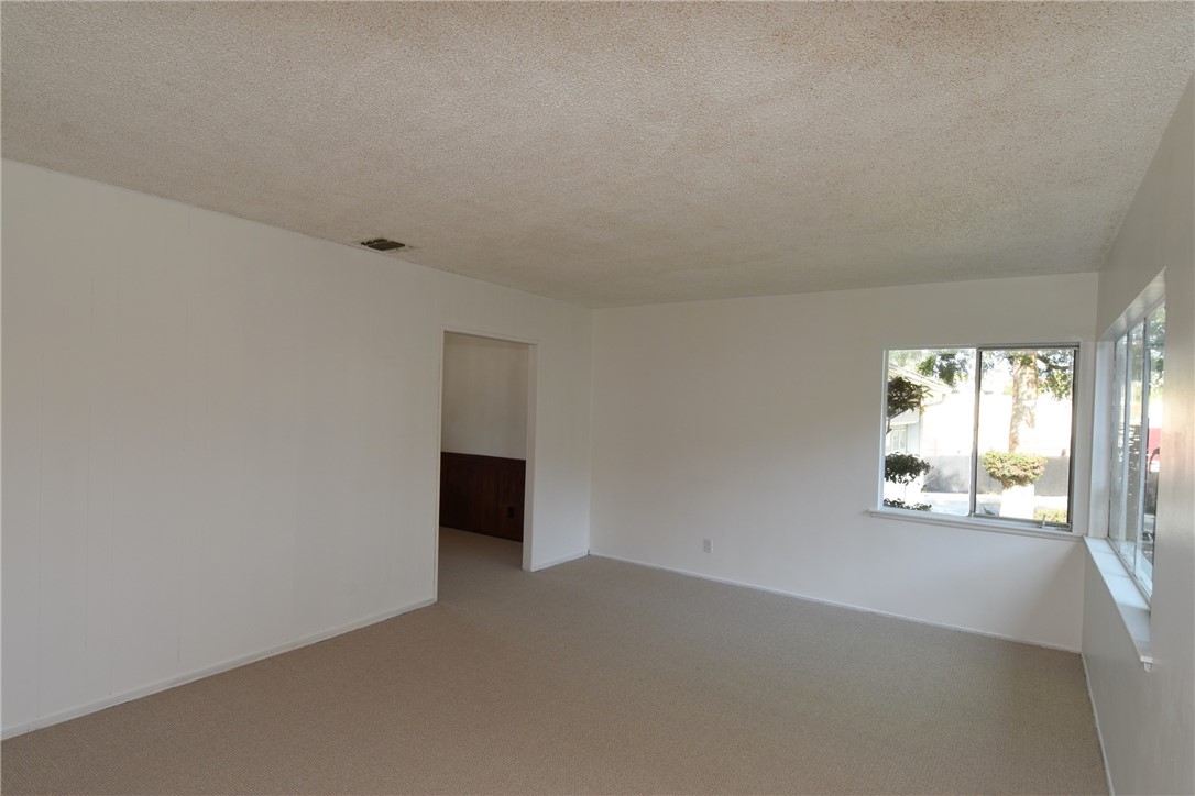 Large living room as seen from the entry. Lots of nice natural lighting, and all new carpet and paint throughout!