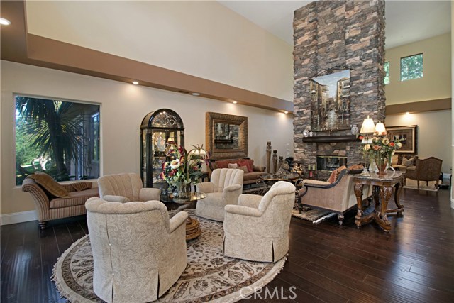 Stacked rock floor to ceiling glass fireplace creates a relaxing ambiance in the family room.