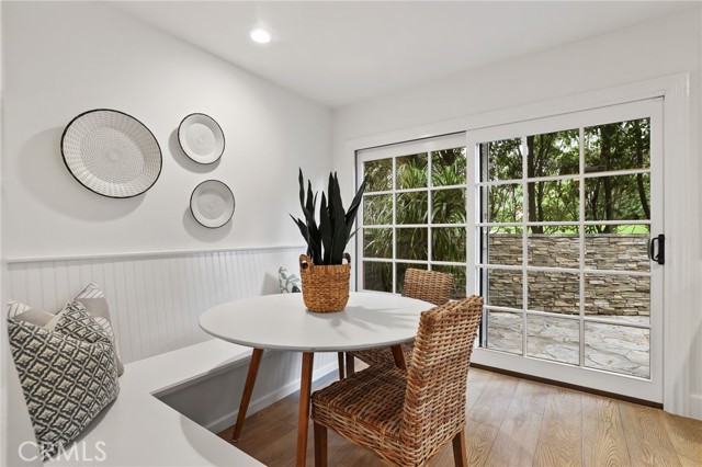 Versatile breakfast nook overlooking the side patio and BBQ area
