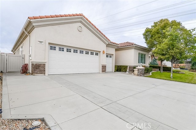 1587 Paradise Circle Beaumont, California Beautiful 2 bedroom, 2.5 bathroom, single story home on a cul-de-sac street in the gated, 55 and over community of Solera Oak Valley Greens in Beaumont! Enjoy an open floor plan, plantation shutters, crown molding, and an inviting fireplace. The kitchen offers corian countertops, a walk-in pantry, and a center island with a breakfast bar that opens to the breakfast nook and family room. The primary bedroom features a walk-in closet, dual sinks in the primary bathroom, a walk-in shower, and a soaking tub. French doors lead to the covered outdoor patio and back yard. Additional property highlights include a laundry room with a sink and a 3 car garage. Community amenities include a swimming pool, spa, barbecue, golf course, sport courts, and a clubhouse. Convenient to local schools, area parks, shopping plazas, and easy access to major freeways!