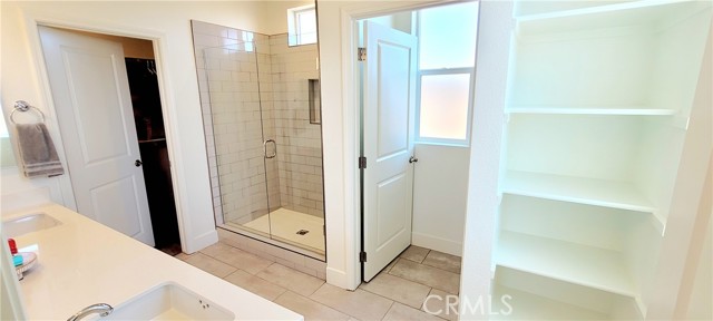 Large shower with upgraded glass door. Walk in closet.