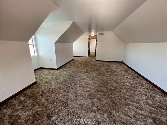 Upper level with large room that can be used as an entertainment room or bedroom #4.