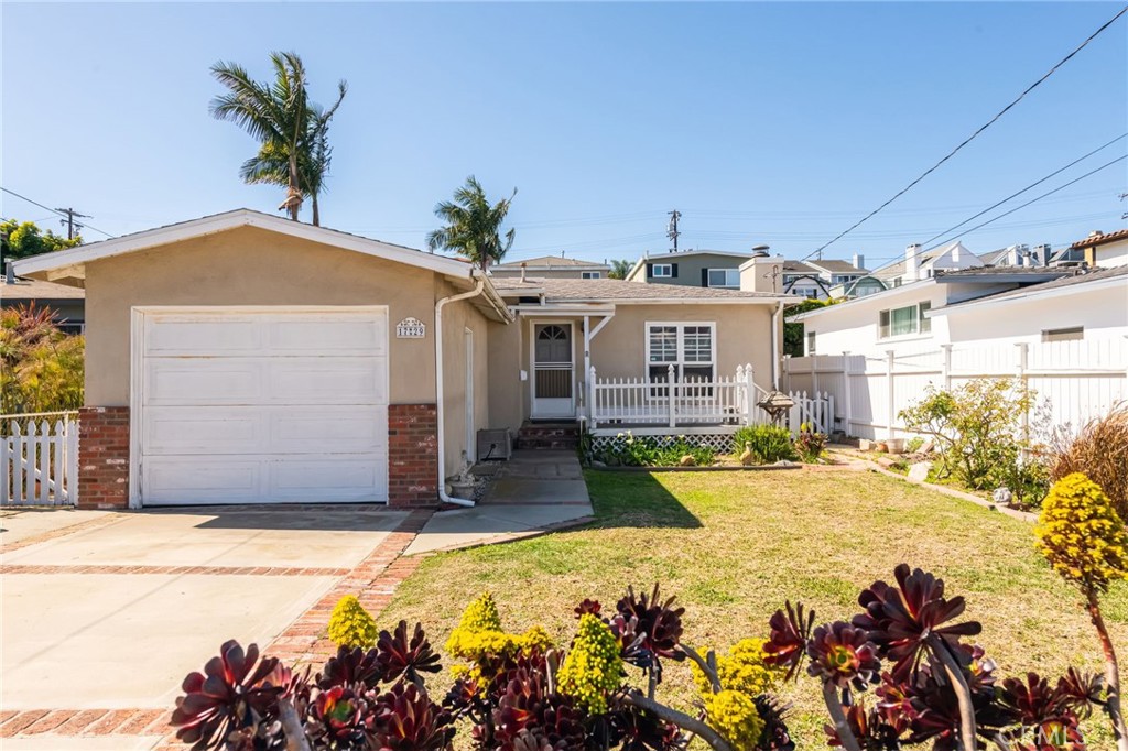 Diamond in the rough!  This charming 3 bedroom, 2 bath beach cottage needs a little love and has so much potential!  Hardwood floors in living room and 2 of the bedrooms. The rear bedroom is ensuite and opens to the backyard.  Two fireplaces. Situated on a quiet street on an oversized lot in the Golden Triangle of North Redondo Beach.  Just a stone's throw away from Manhattan Beach's Mira Costa High School and only a mile to the ocean.  Bring your imagination and roll up your sleeves to make this home a gem.  Property is being sold in AS-IS condition.