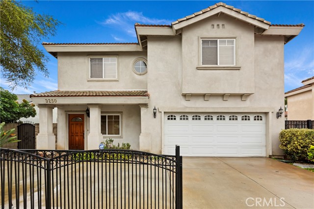 Front of home with private gate.