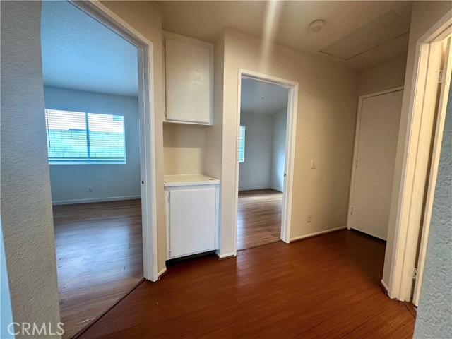 Hallway to the 2nd and 3rd bedroom, garage access and 2nd bathroom