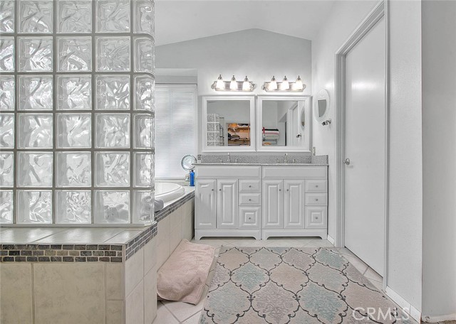 Twin vanities, glass block