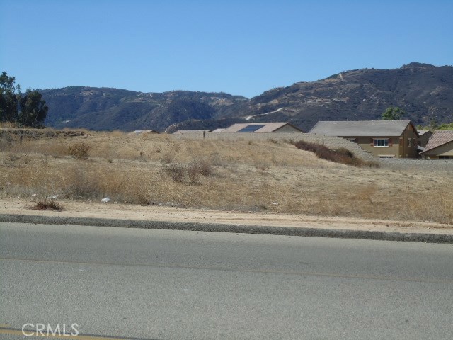 2.42 Acres land. currently zoned RR (can be utilized as commercial uses-recommend checking with City of Wildomar for zoning and land uses allowed). property fronts Hidden Springs Rd. directly across the driveway entrance to the Bear Creek Village Shopping Center which is anchored by Stater Bros. Market and has big retailers like Chase Bank, Del Taco, Jack in the Box and others! Ideal use for this lot would be a nice neighborhood commercial center to complement the Stater Bros. Center. Location is off the I-15FWY at Clinton Keith. many commercial and residential developments have been built very close to this property in the last couple of years!