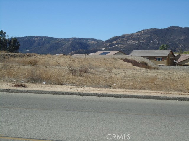 2.42 Acres land. currently zoned RR (can be utilized as commercial uses-recommend checking with City of Wildomar for zoning and land uses allowed). property fronts Hidden Springs Rd. directly across the driveway entrance to the Bear Creek Village Shopping Center which is anchored by Stater Bros. Market and has big retailers like Chase Bank, Del Taco, Jack in the Box and others! Ideal use for this lot would be a nice neighborhood commercial center to complement the Stater Bros. Center. Location is off the I-15FWY at Clinton Keith. many commercial and residential developments have been built very close to this property in the last couple of years!