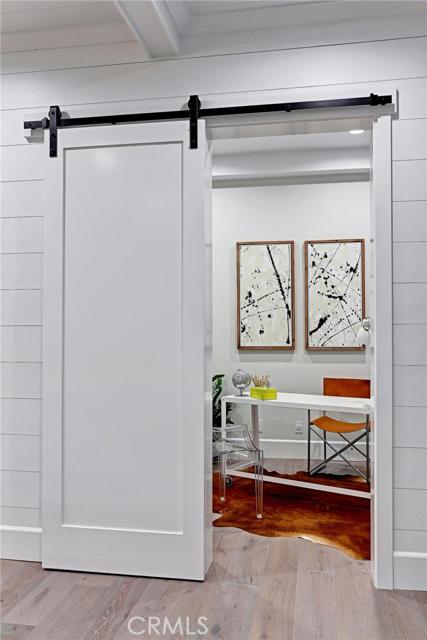Office, study or den behind sliding barn door