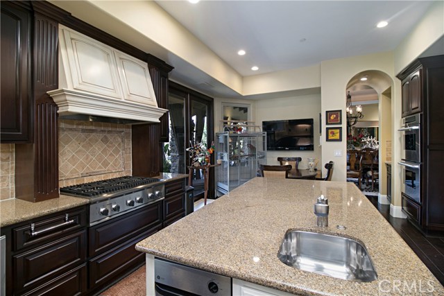 The Kitchen opens to the breakfast room which overlooks the lanai and lavish greenery.