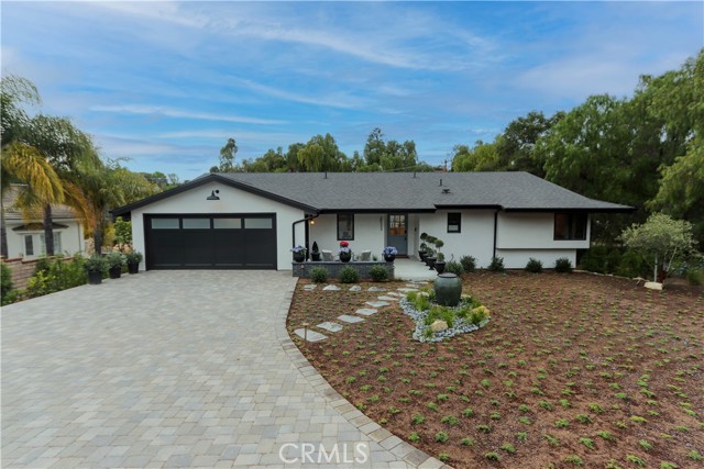 The striking exterior of this home has exceptional curb appeal complimented by professional landscaping with water feature, a welcoming front porch and expansive driveway with generous off-street parking.